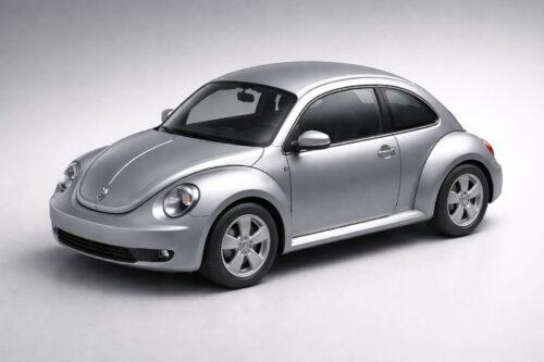 Silver car with rounded design on a gray background, resembling a classic Volkswagen Beetle.