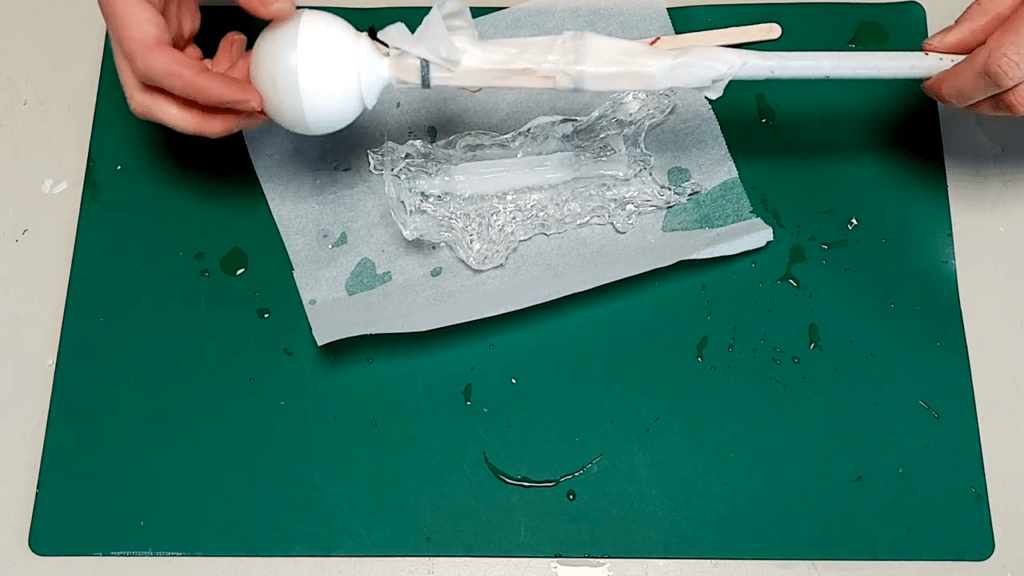 The material is removed from the cane. No residue remains on the cane thanks to the previously applied painters tape.