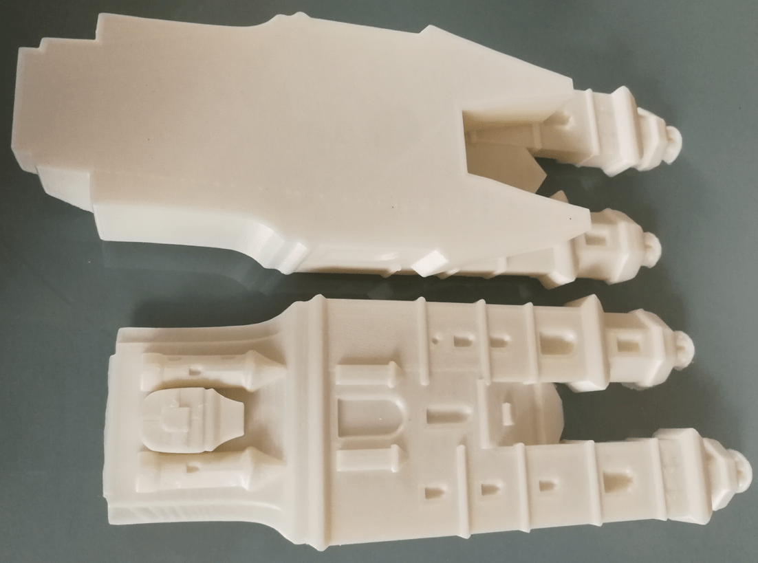 The digital model of a tower was cut into two parts and printed sperately.