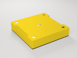 EN: Underside of the yellow tray with five embedded round magnets. DE: Unterseite der gelben Schale mit fünf eingelassenen runden Magneten.